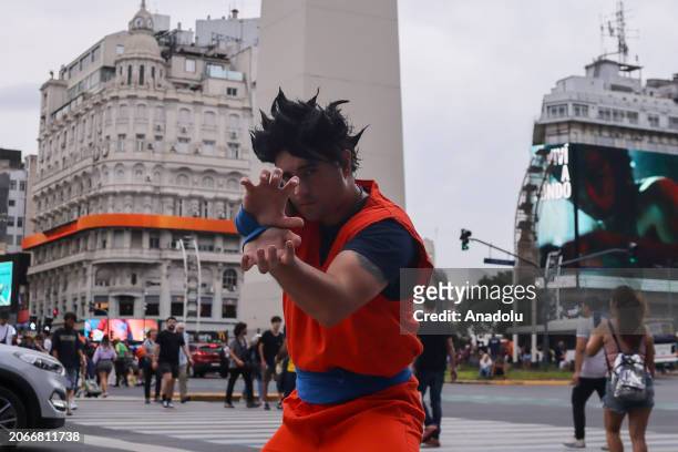 Man wearing cartoon character costume poses for a photo as hundreds of Dragon Ball fans, a Comic created by Akira Toriyama, gather at Plaza del...