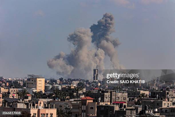 Picture taken from Rafah shows smoke billowing over Khan Yunis in the southern Gaza Strip during Israeli bombardment on March 11 amid ongoing battles...