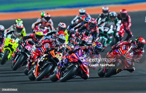 Spanish MotoGP rider Jorge Martin of Prima Pramac Racing and Italian MotoGP rider Francesco Bagnaia of Ducati Lenovo Team are leading the pack during...
