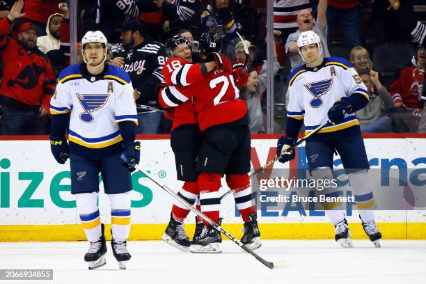 Timo Meier of the New Jersey Devils celebrates his second goal of the game against the St. Louis Blues at 16:04 of the first period and is joined by...