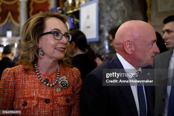 Sen. Mark Kelly and his wife Gabby Giffords attend President Joe Biden's State of the Union address during a joint meeting of Congress in the House...