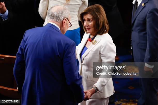 Rep. Nancy Pelosi talks to Senate Majority Leader Charles Schumer prior to the start of President Joe Biden's State of the Union address during a...