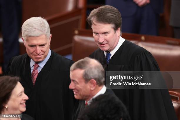 Supreme Court Associate Justices Neil Gorsuch and Brett Kavanaugh arrived with fellow Justice Sonia Sotomayor and Chief Justice John Roberts for U.S....