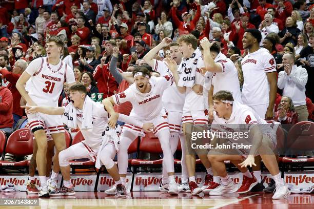 Wisconsin Badgers bench reacts after a dunk by AJ Storr in the second half of the game against the Rutgers Scarlet Knights at Kohl Center on March...