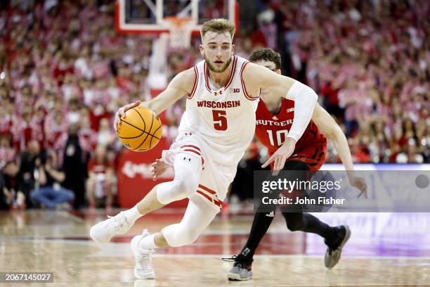 Tyler Wahl of the Wisconsin Badgers drives to the basket in the second half of the game against the Rutgers Scarlet Knights at Kohl Center on March...