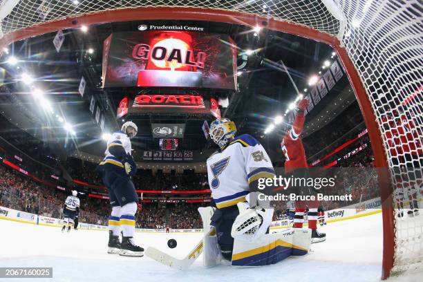 Nico Hischier of the New Jersey Devils celebrates a goal by Timo Meier at 16:04 of the first period against Jordan Binnington of the St. Louis Blues...