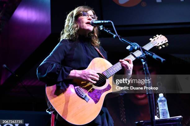 Lisa Loeb performs during the "Revolutionary Women in Music: Left of Center" exhibit dedication at the Rock & Roll Hall of Fame and Museum on March...