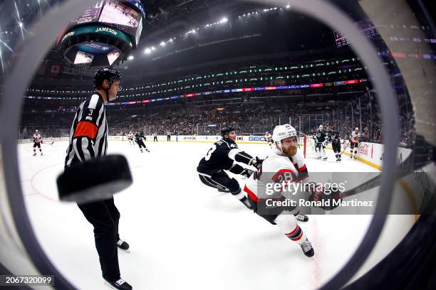Claude Giroux of the Ottawa Senators skates for the puck against Jacob Moverare of the Los Angeles Kings in the first period at Crypto.com Arena on...