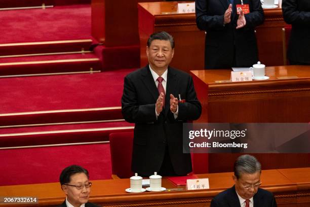 Xi Jinping, China's president, center, during the closing of the Second Session of the 14th National People's Congress at the Great Hall of the...