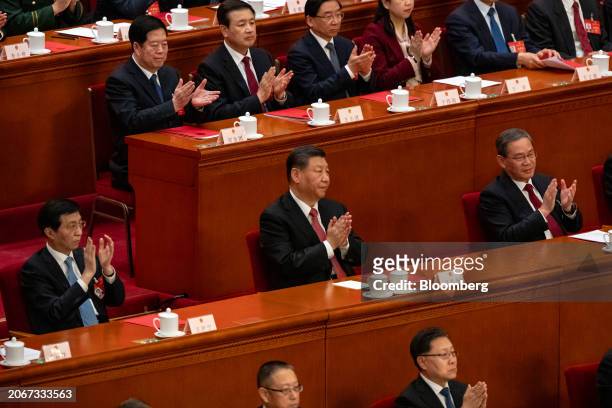 Xi Jinping, China's president, center, Li Qiang, China's premier, right, and Wang Huning, chairman of the Chinese People's Political Consultative...