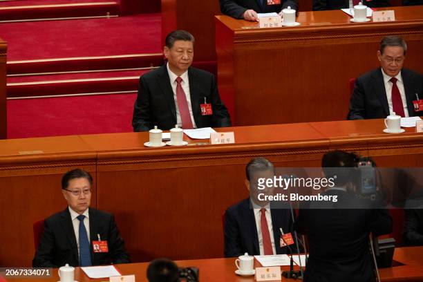 Xi Jinping, China's president, top left, and Li Qiang, China's premier, top right, during the closing of the Second Session of the 14th National...