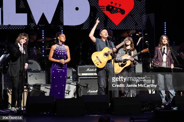 Luke Spiller, Allison Russell, Tom Morello, and Rebecca Lovell and Megan Lovell of Larkin Poe perform onstage during the Eighth Annual LOVE ROCKS NYC...