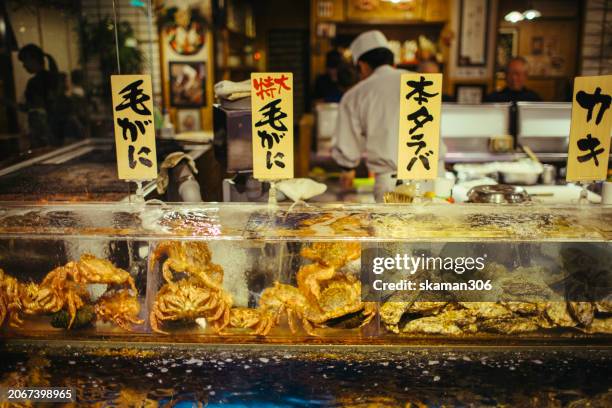 close-up fresh ingredients for japanese cuisine alaska king crab and taraba crab at fish market hakodate hokkaido japan - chuo ward tokyo stock pictures, royalty-free photos & images