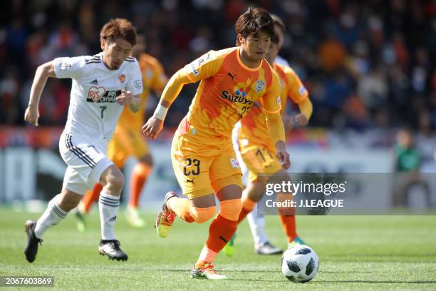 Koya Kitagawa of Shimizu S-Pulse controls the ball against Hiroaki Okuno of Vegalta Sendai during the J.League J1 match between Shimizu S-Pulse and...