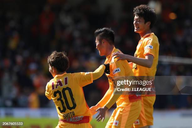 Shota Kaneko of Shimizu S-Pulse celebrates with teammates Hwang Seok-ho and Yugo Tatsuta after scoring the team's first goal during the J.League J1...