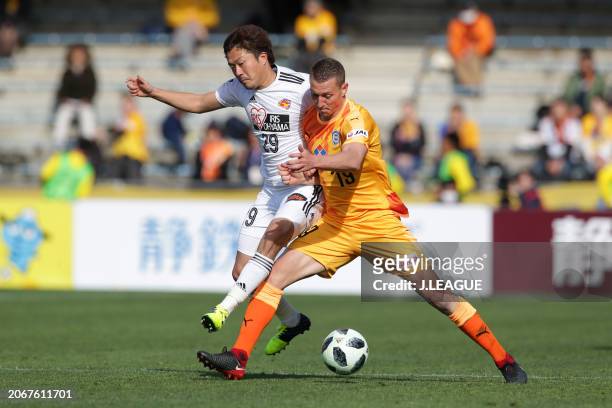 Mitchell Duke of Shimizu S-Pulse controls the ball against Shota Kobayashi of Vegalta Sendai during the J.League J1 match between Shimizu S-Pulse and...