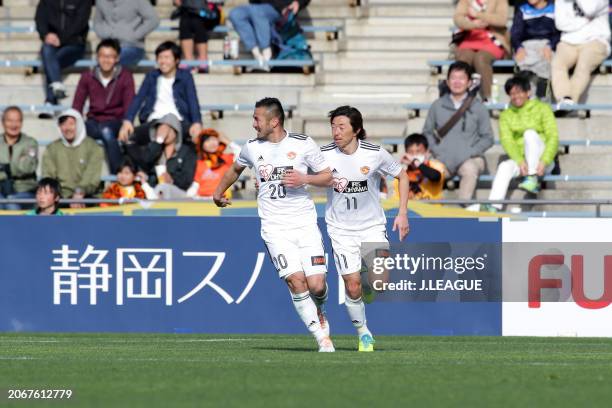 Takuma Abe of Vegalta Sendai celebrates with teammate Naoki Ishihara after scoring the team's first goal during the J.League J1 match between Shimizu...