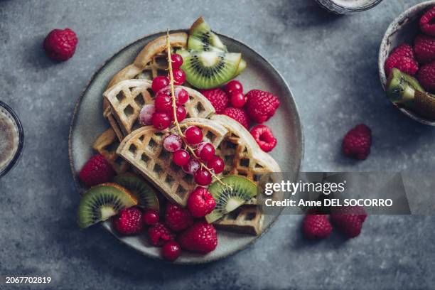Homemade Heart Shaped Waffles With Kiwi Raspberries And Currant Fruits For Breakfast High-Res Stock Photo