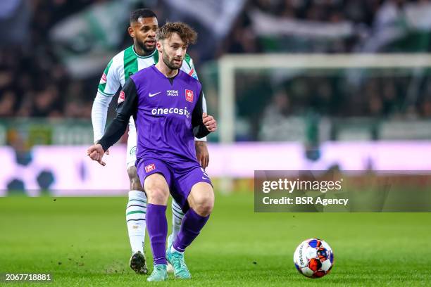 Mart Remans of MVV is challenged by Leandro Bacuna of FC Groningen during the Dutch Keuken Kampioen Divisie match between FC Groningen and MVV...