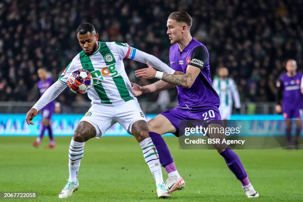 Leandro Bacuna of FC Groningen is challenged by Bryant Nieling of MVV during the Dutch Keuken Kampioen Divisie match between FC Groningen and MVV...