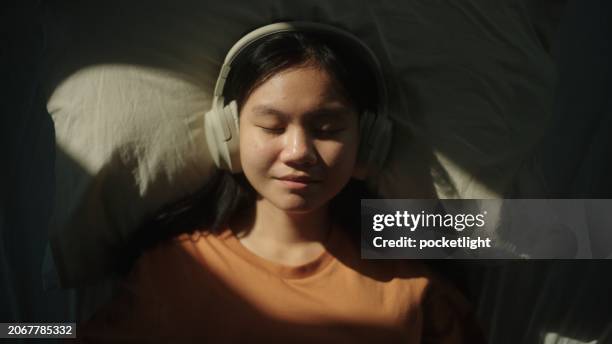 portrait of girl listening to relax sound. - attitude stock pictures, royalty-free photos & images