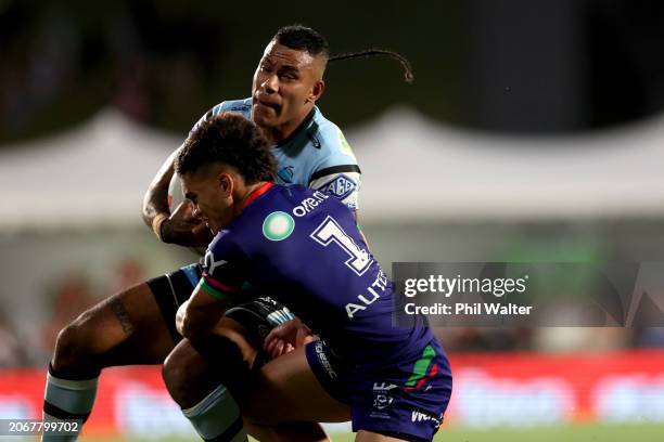 Sione Katoa of the Sharks is tackled during the round one NRL match between New Zealand Warriors and Cronulla Sharks at Go Media Stadium Mt Smart, on...