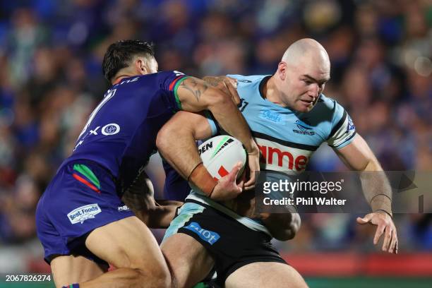 Thomas Hazelton of the Sharks is tackled during the round one NRL match between New Zealand Warriors and Cronulla Sharks at Go Media Stadium Mt...