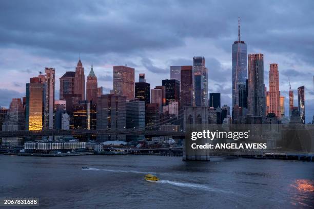 View of the skyline of lower Manhattan is seen during sunrise on March 11, 2024 in New York City.