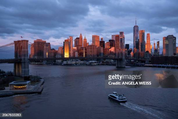 View of the skyline of lower Manhattan is seen during sunrise on March 11, 2024 in New York City.