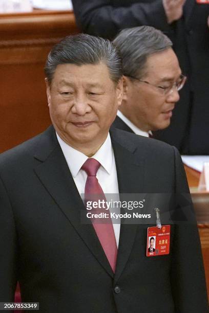Chinese President Xi Jinping and Premier Li Qiang are pictured on the last day of the annual session of the National People's Congress at the Great...