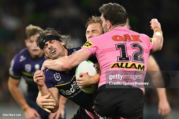 Ryan Papenhuyzen of the Storm is tackled during the round one NRL match between Melbourne Storm and Penrith Panthers at AAMI Park on March 08 in...
