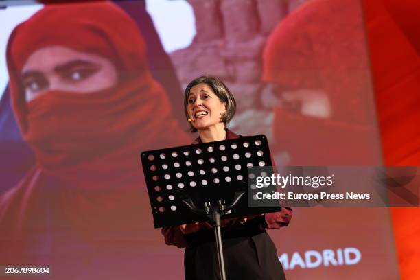 Woman reading the poem "No deseo abrir la boca" by Nadia Anjuman, during the institutional commemorative ceremony for International Women's Day, 8M,...