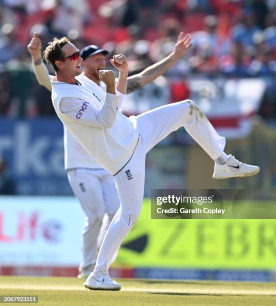 Tom Hartley of England celebrates with captain Ben Stokes after taking the wicket of Ravindra Jadeja of India during day two of the 5th Test Match...