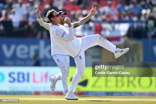 Tom Hartley of England celebrates with captain Ben Stokes after taking the wicket of Ravindra Jadeja of India during day two of the 5th Test Match...