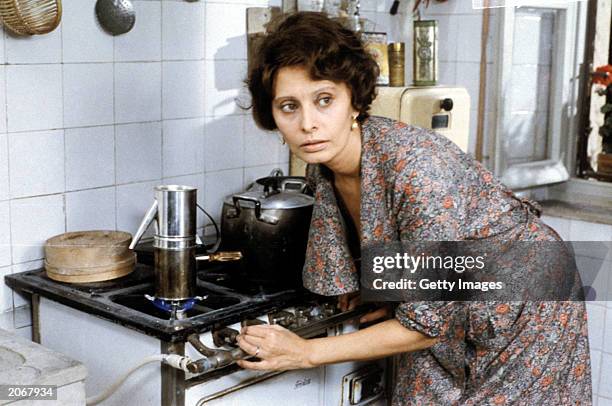 In this undated handout photo, actress Sophia Loren plays her role while filming the1977 movie "Una Giornata Particolare" in Rome, Italy. Loren...