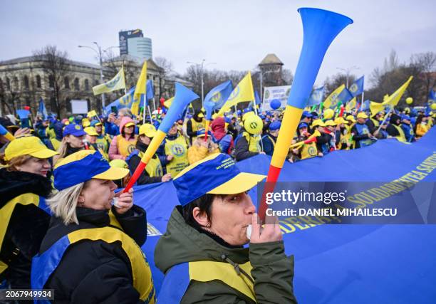 Health workers protest in the front of the Romanian Government's headquarters in Bucharest, Romania, on March 11, 2024. Following a call from the...