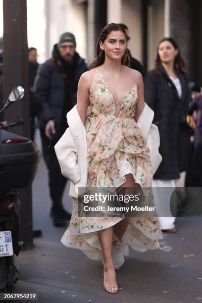 Valentina Ferragni was seen wearing beige sandals, beige jacket and a rose and beige dress as well as yellow gold diamond earrings outside before...