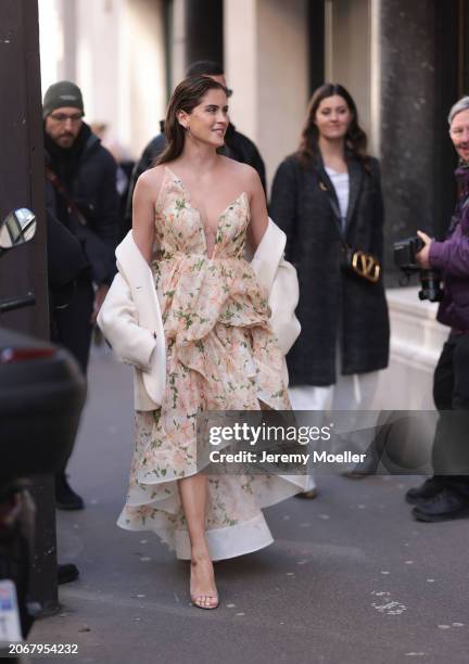 Valentina Ferragni was seen wearing beige sandals, beige jacket and a rose and beige dress as well as yellow gold diamond earrings outside before...