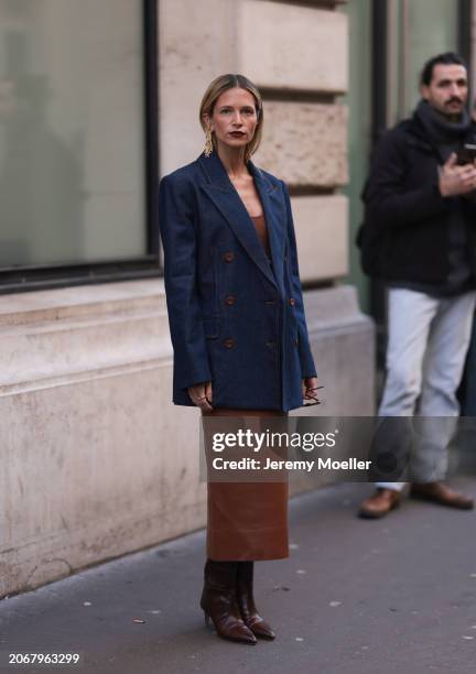 Helena Bordon was seen wearing brown heels, yellow gold earrings, an oversized denim jeans jacket, shades as well as a brown dress outside before...