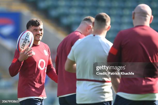 George Furbank of England interacts with teammates during the England Captain's Run at Twickenham Stadium on March 08, 2024 in London, England.