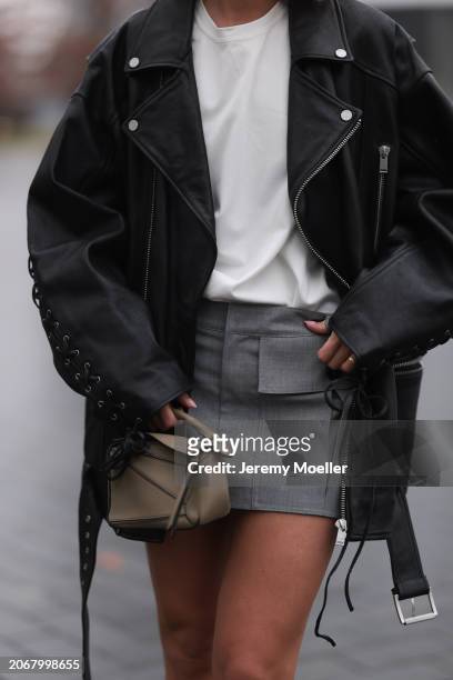 Nadine Berneis seen wearing Young Poets black oversized leather jacket, Zwingenberg Studio white cotton t-shirt, Zwingenberg Studio grey short skirt...