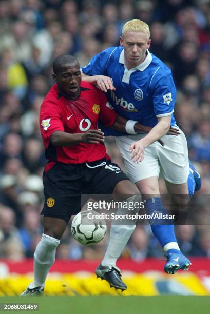 April 10: Eric Djemba-Djemba of Manchester United and Mikael Forssell of Birmingham City challenge during the Premier League match between Birmingham...