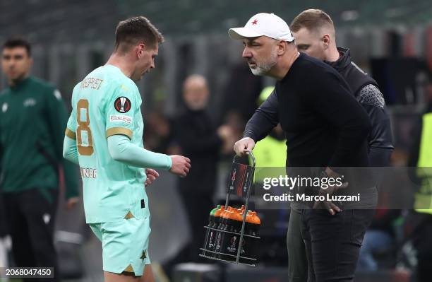 Slavia Praha head coach Jindrich Trpisovsky issues instructions to his player Lukas Masopust during the UEFA Europa League 2023/24 round of 16 first...