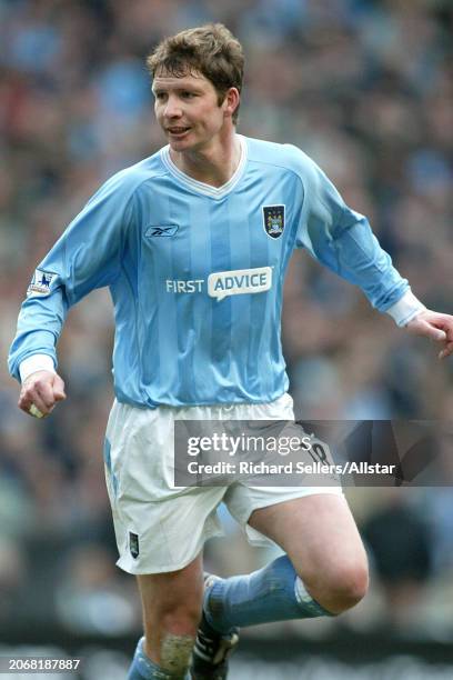 March 14: Michael Tarnat of Manchester City running during the Premier League match between Manchester City and Manchester United at Sports City on...