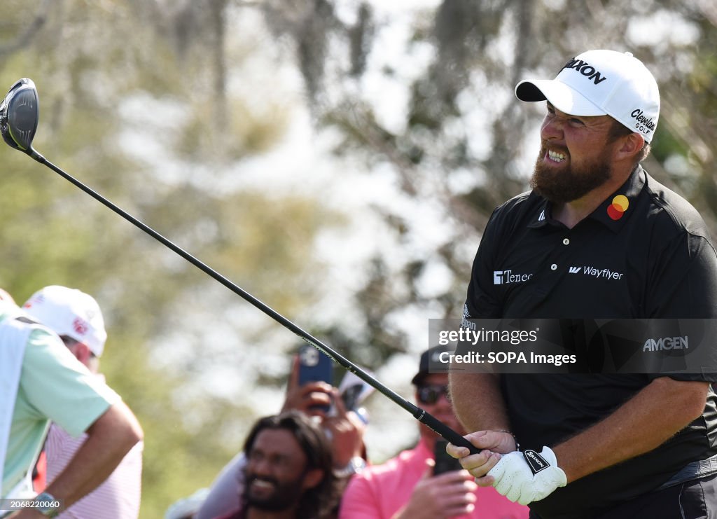 Shane Lowry of Ireland hits his tee shot on the tenth hole...