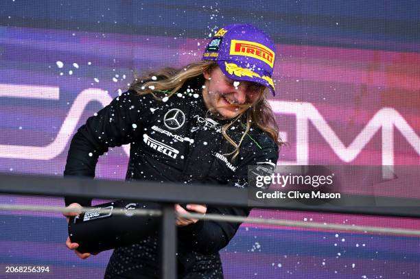 Race winner Doriane Pin of France and PREMA Racing celebrates on the podium during Round 1 Jeddah race 1 of the F1 Academy at Jeddah Corniche Circuit...