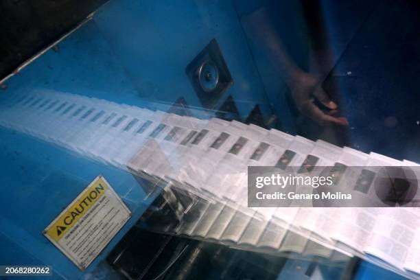 The last printing of the LA Times takes on a ghostly presence as Operator John Martin prepares to pull a paper to check for register and color...