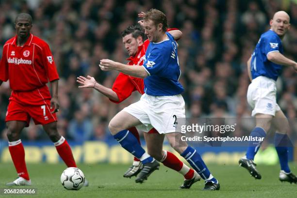 March 27: Steve Watson of Everton and Franck Queudrue of Middlesbrough challenge during the Premier League match between Everton and Middlesbrough at...