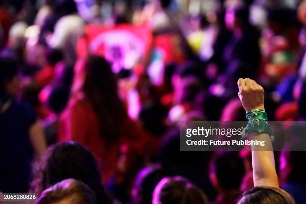 March 10 Mexico City, Mexico: A supporter of the Mexico's Presidential candidate for the 'Fuerza y Corazon' coalition, lifts her fist to support...