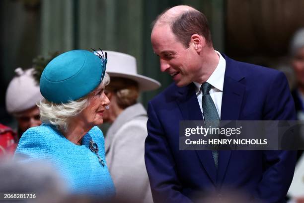 Britain's Queen Camilla and Britain's Prince William, Prince of Wales speak together as they attend an annual Commonwealth Day service ceremony at...